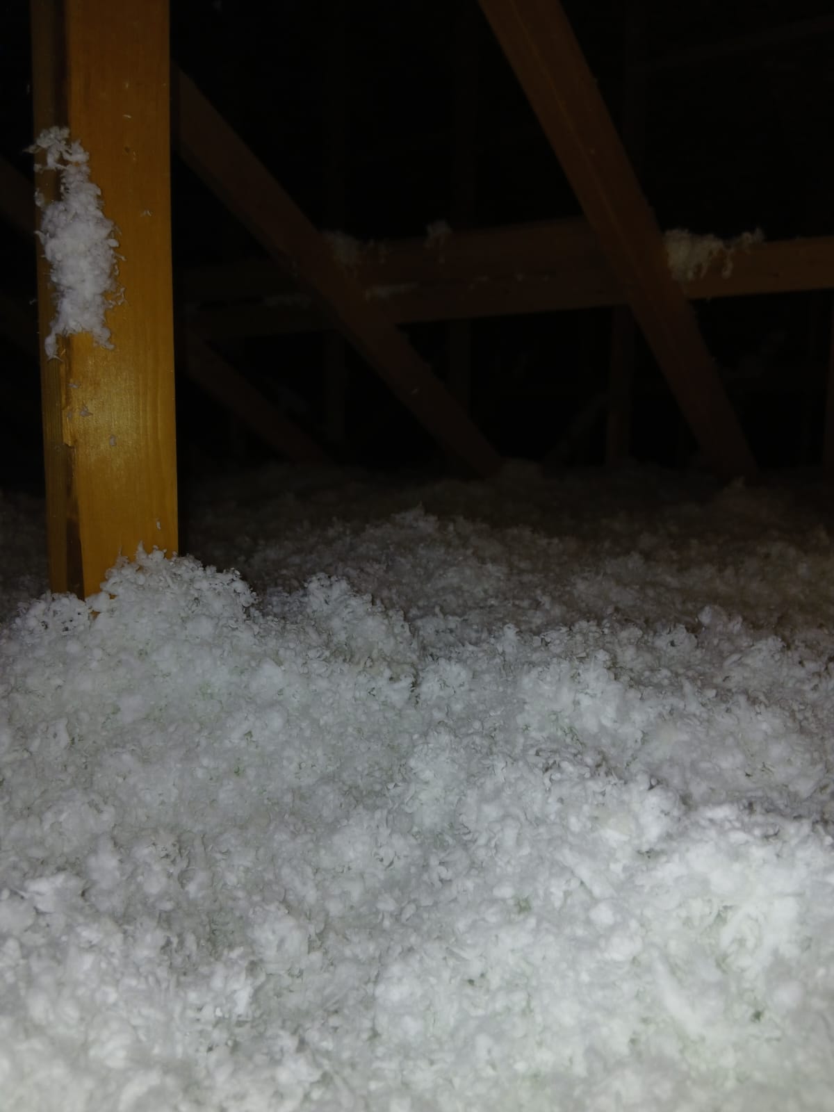 Attic insulation with yellow beam support — SHS Insulation project